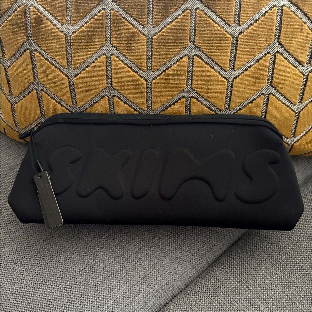 SKIMS Black Embossed Pouch